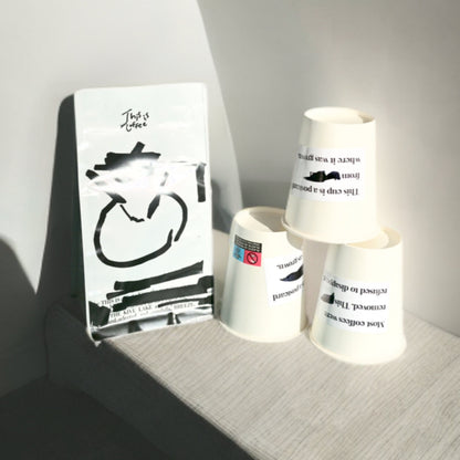 DR Congo Kivu Mutendero coffee bag placed along with THISISnotCOFFEE paper cups
